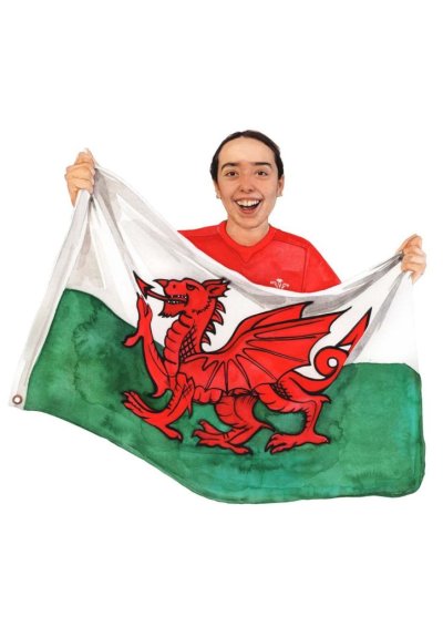 Student holding Welsh flag