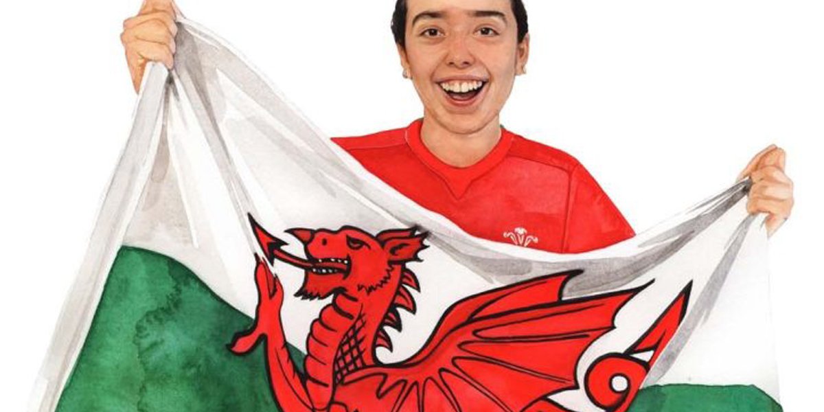 Student holding Welsh flag