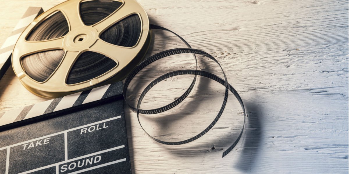 Movie Reels laying on a wooden desk