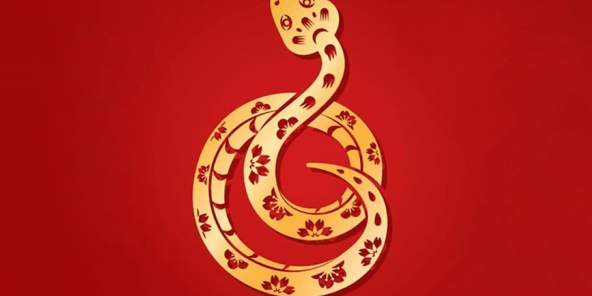 A golden snake curled up on a red background to symbolise Chinese New Year